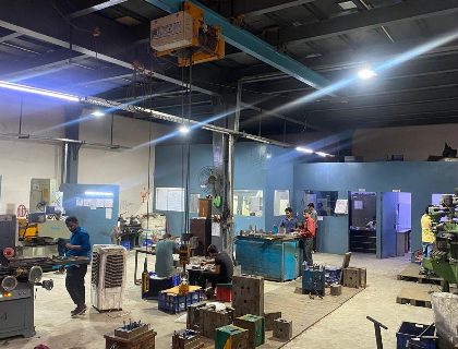 The Trumould tool room, with mold bases on the floor and benches along the far wall