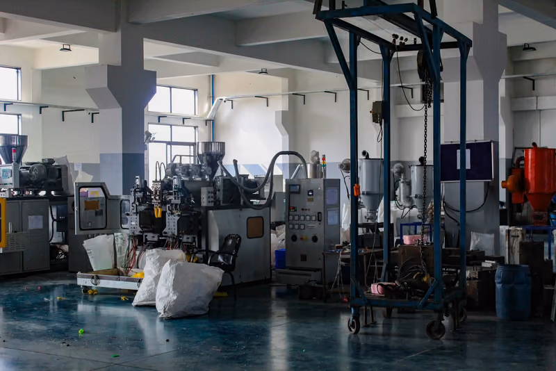 Interior of a molding plant with presses and material handling