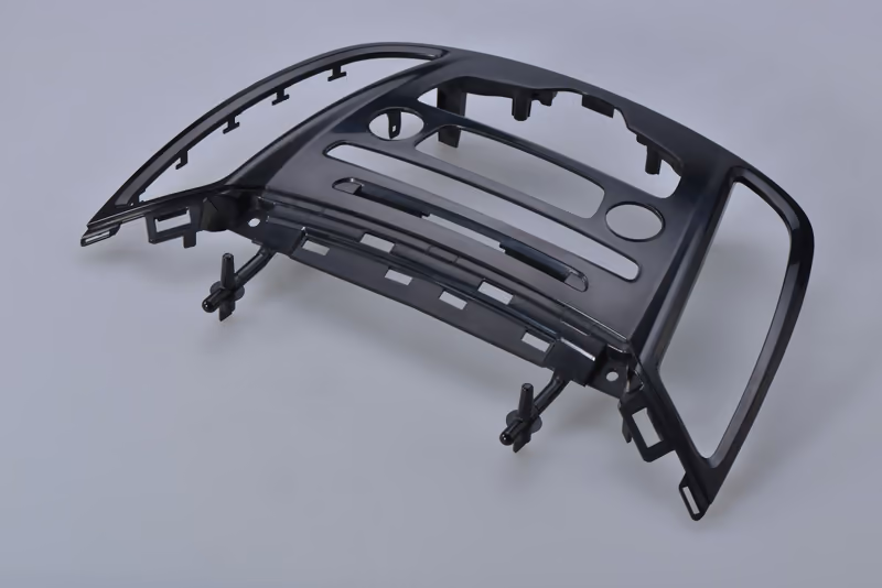 Molded automotive trim bezel